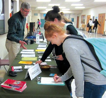 Wendell Wiebe-Powell talks with students at Concord High School. He and other members of Elkhart Advocates for Peace and Justice are taking a message of peace to the schools and providing information about alternatives to military service. — Elkhart Advocates for Peace and Justice